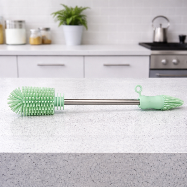 Haakaa Double-Ended Silicone Brush for easy bottle cleaning, showcasing its flexible design and durable material.