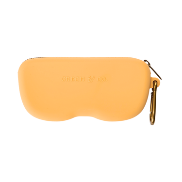 Soft silicone Zip + Go Case in buckwheat color, perfect for baby accessories and seasonal wear.