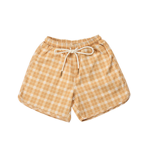 Baby swim trunks in buckwheat plaid, featuring UPF protection and made from recycled materials.
