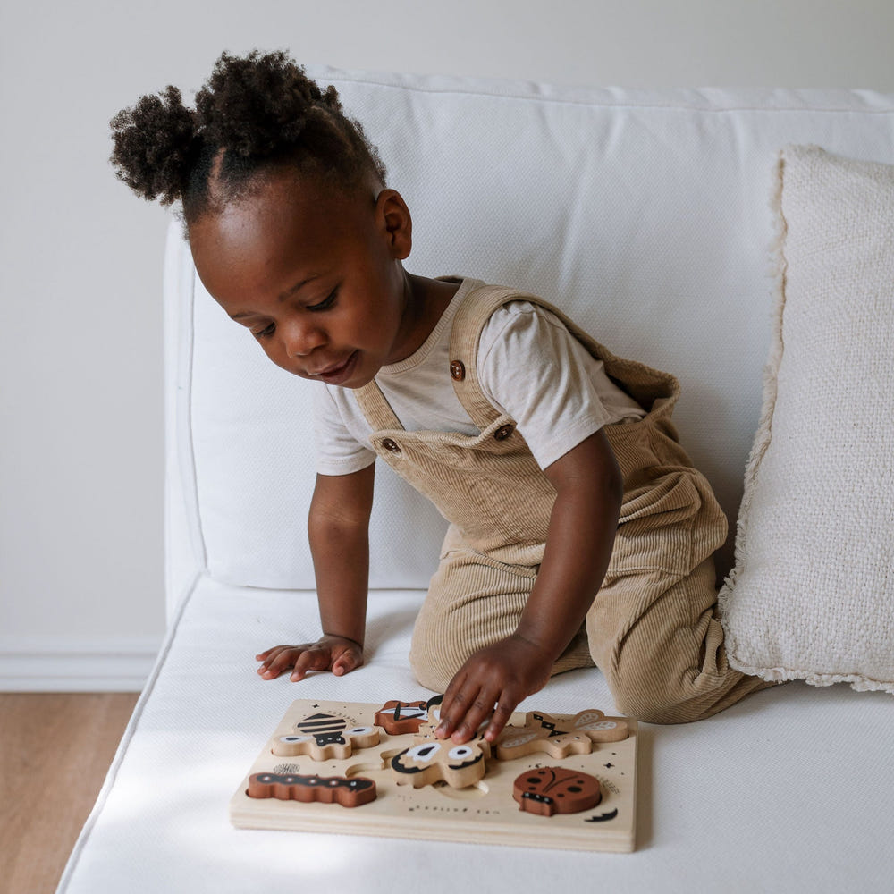 Wooden tray puzzle featuring colorful bugs, perfect for toddlers' learning and playtime.