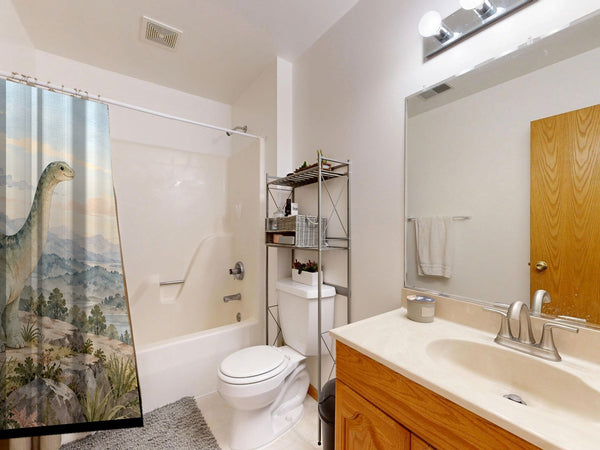 Mountain Dinosaur shower curtain on a tub shower combo in an American family bathroom