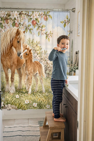 Child brushing teeth in a family bathroom with the Pony Orchard Farm shower curtain