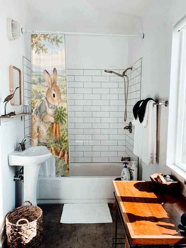 Bunny Garden Farm shower curtain hanging on the rod over a white bathtub