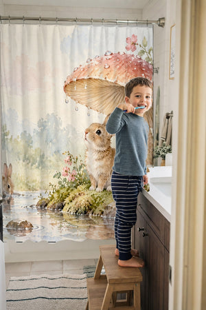 Child brushing teeth in a family bathroom with the After the Rain Bunny shower curtain