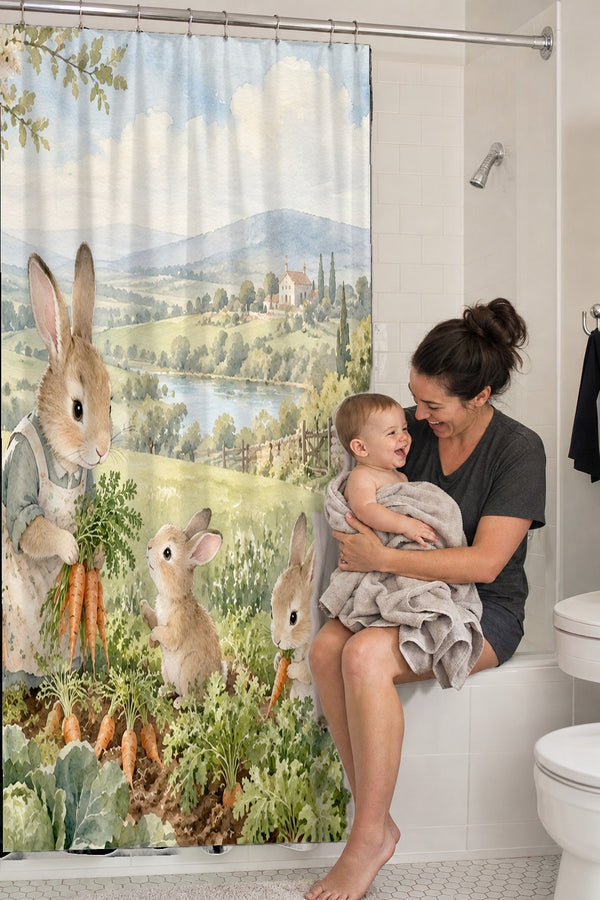 Mom holding her baby on the tub edge next to the Bunny Garden Farm shower curtain