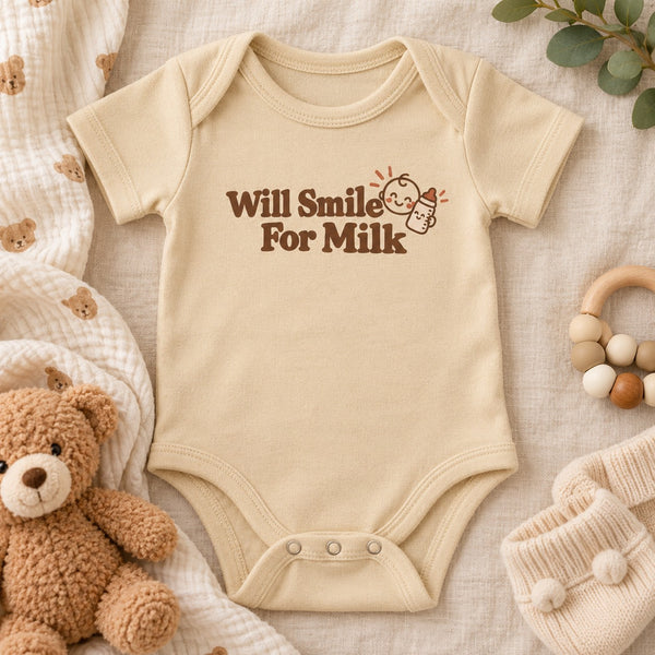 Styled flat lay of the Will Smile For Milk baby bodysuit