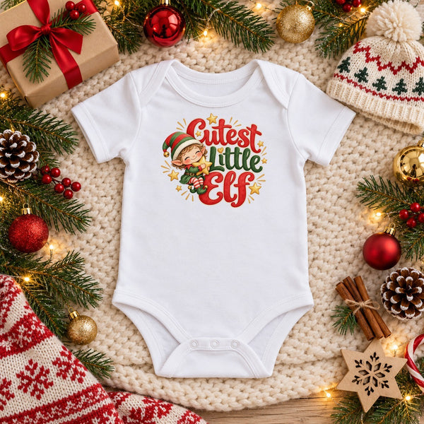 Cutest Little Elf organic cotton baby bodysuit in white, Christmas flat lay