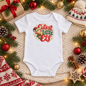 Cutest Little Elf baby bodysuit in white, Christmas flat lay