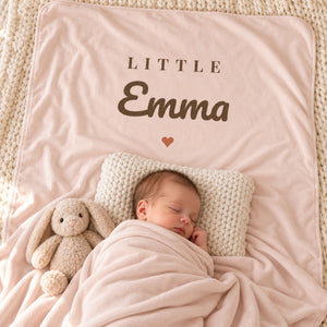 Little Name swaddle blanket in blush, styled photo 2