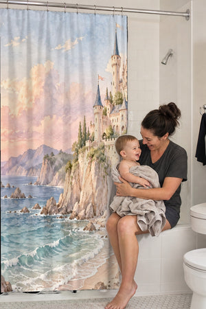 Mom holding her baby on the tub edge next to the Seaside Castle Fairy Tale shower curtain