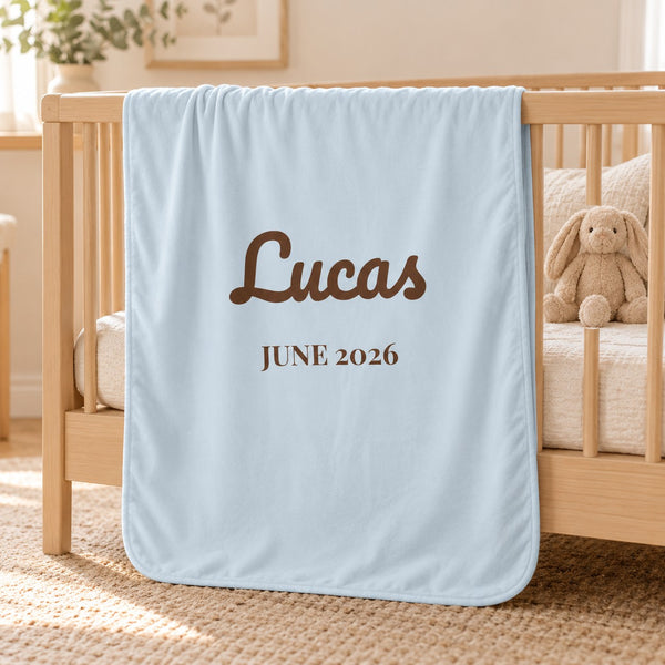 Name and Birth Month swaddle blanket in sky, styled photo 1