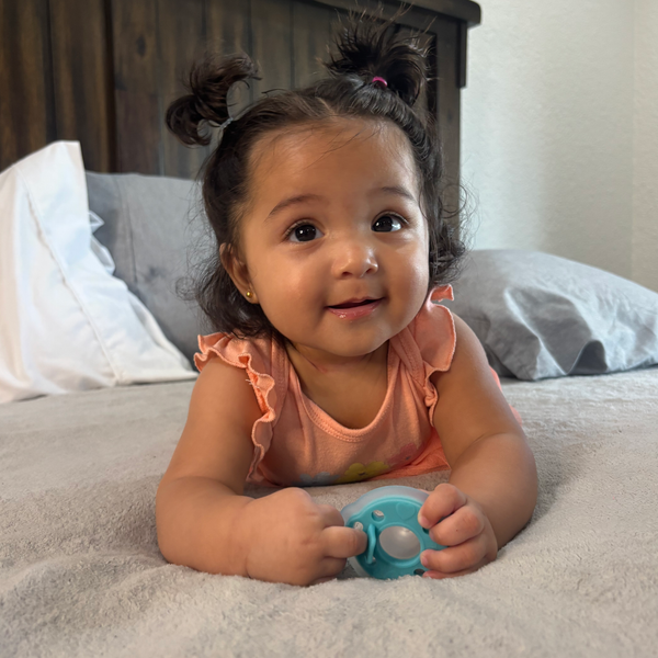 mōmi babypace® breast-like pacifier in multiple vibrant colors