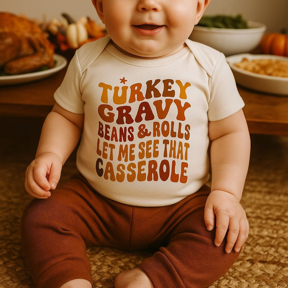Graphic short sleeve bodysuit featuring a fun turkey gravy casserole design for babies.