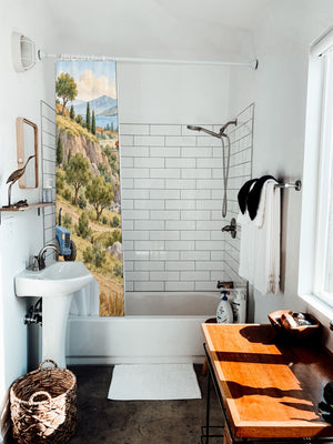 Vehicle Landscape shower curtain hanging on the rod over a white bathtub