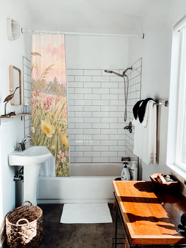 Golden Sunset Wildflowers shower curtain hanging on the rod over a white bathtub