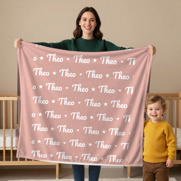 Name Pattern toddler minky blanket in blush, held by a mom