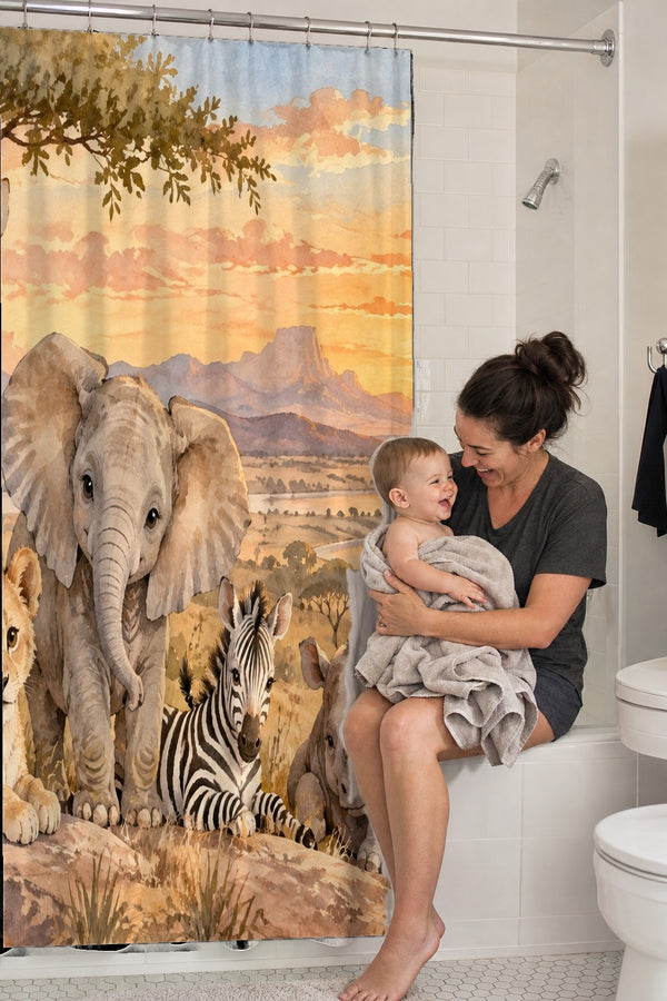 Mom holding her baby on the tub edge next to the Sunset Savanna shower curtain