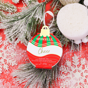 Cheer Sugar Fig Holiday Ornament Body Wash Infused Buffer at an angle, perfect for festive self-care.