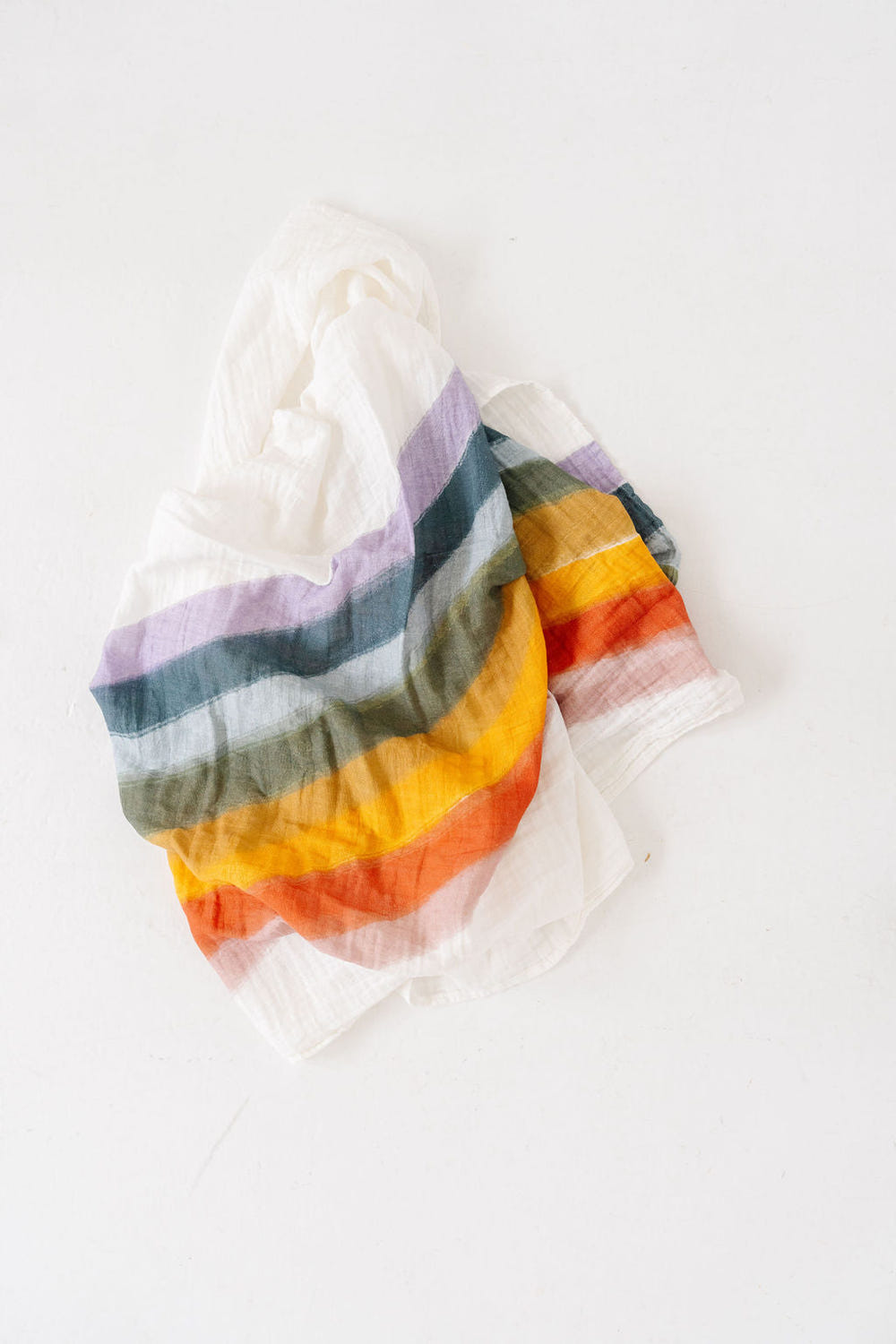 Rainbow Connection Swaddle for babies, featuring a colorful design for comfort and style. Perfect for cozy sleep.