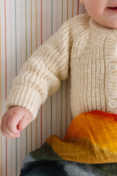 Rainbow Stripe Crib Sheet for a colorful and cozy nursery bedding solution.