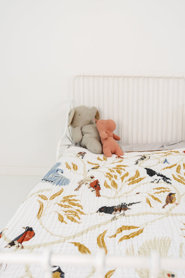 Cozy For the Birds Throw Blanket at an angle, perfect for baby nurseries and cuddling.