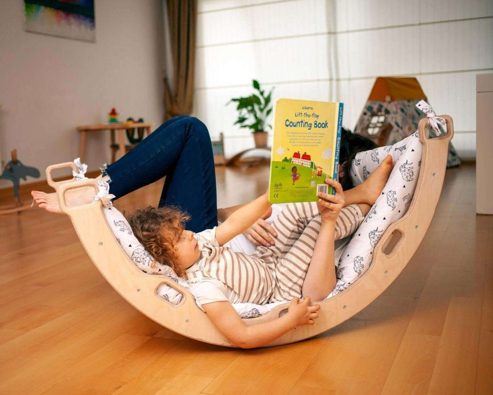 Montessori climbing arch rocker with origami pillow for baby play, promoting physical development and creativity.