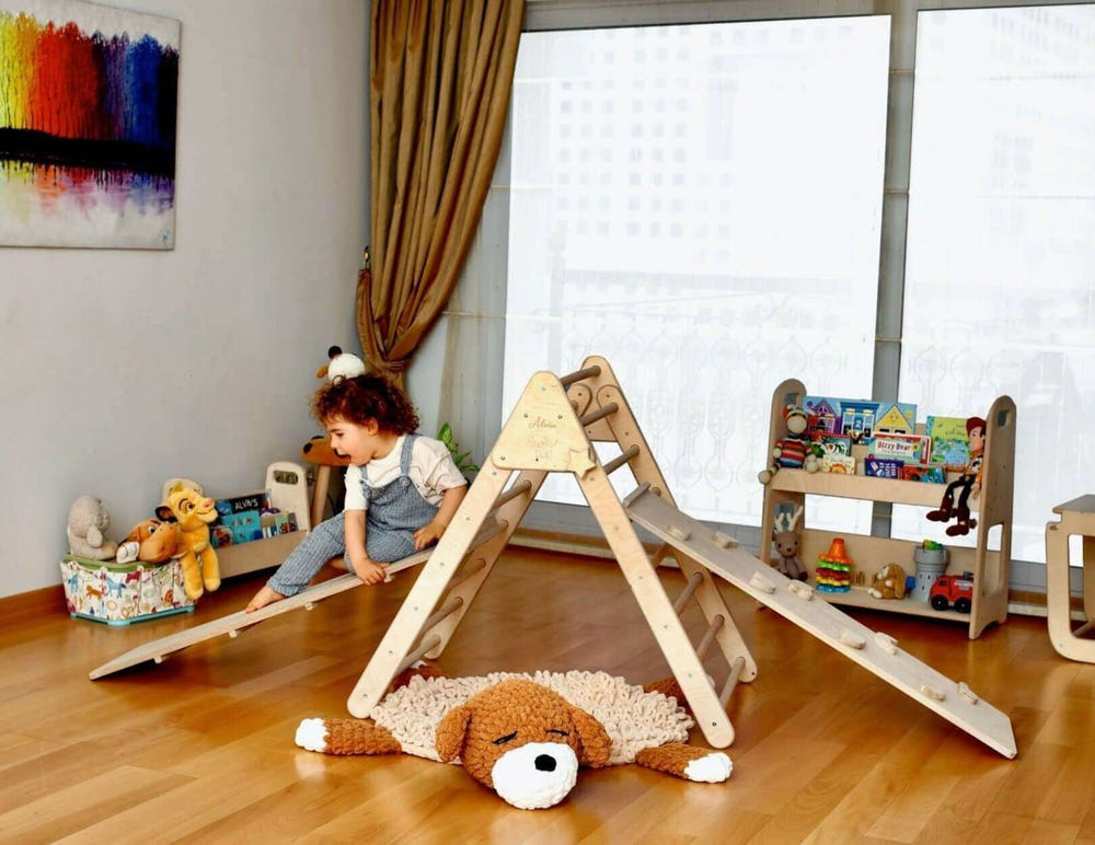 Foldable Montessori climbing triangle with ramp for babies, promoting active play and development.