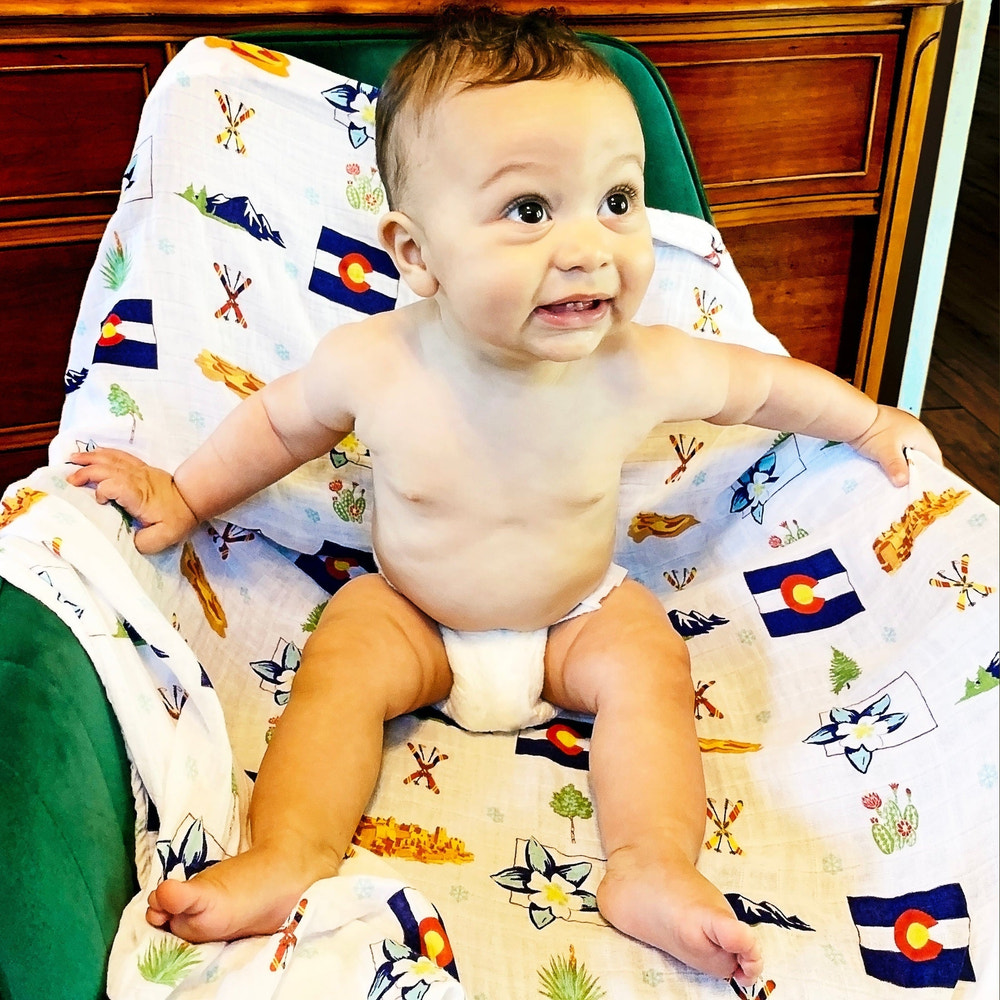 Colorado Baby Muslin Swaddle Blanket and Burp Cloth/Bib Combo Gift Set for infants, perfect for swaddling and feeding.