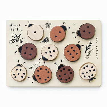 Wooden tray puzzle featuring ladybugs, helping babies learn to count to 10 in a fun and engaging way.