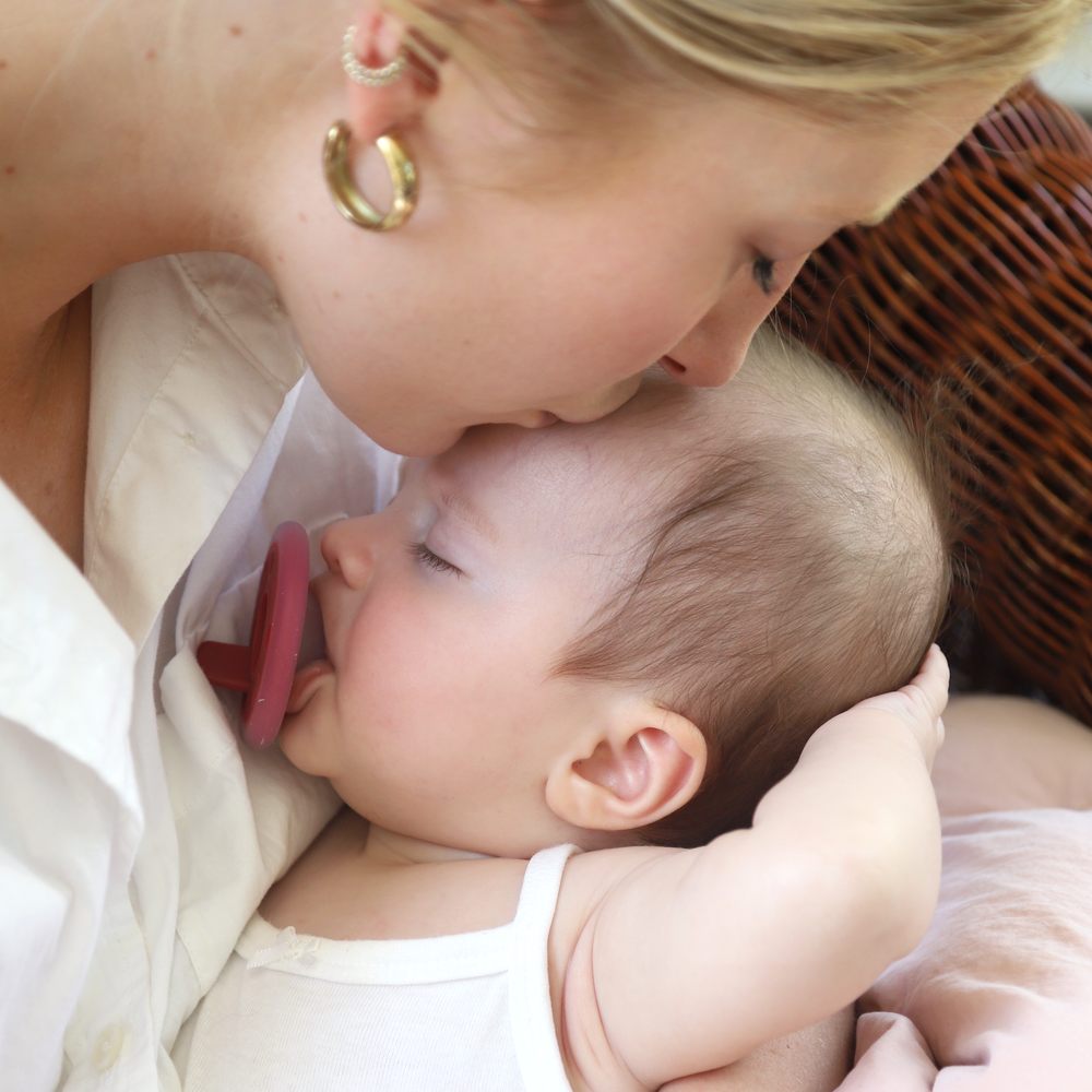 mōmi babypace® breast-like pacifier in multiple vibrant colors