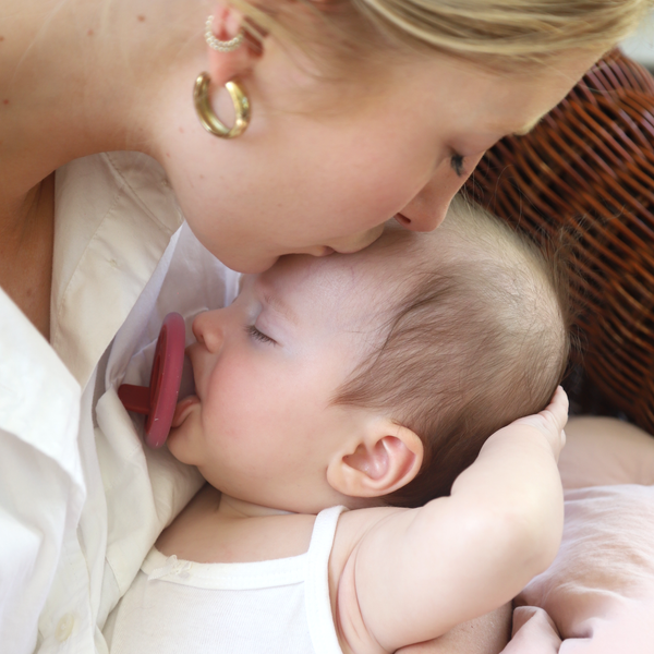 mōmi babypace® breast-like pacifier in multiple vibrant colors