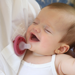 mōmi babypace® breast-like pacifier in multiple vibrant colors