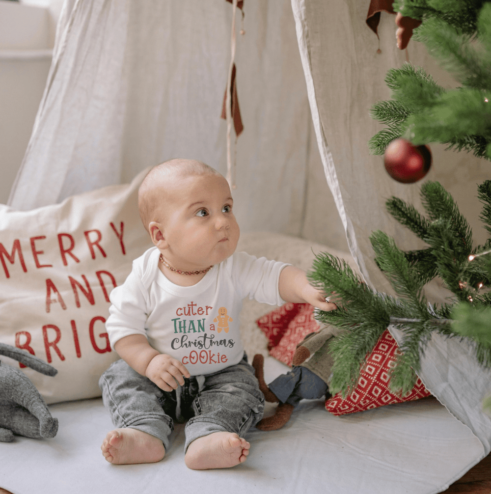 Long sleeve graphic bodysuit featuring a festive Christmas cookie design for babies.