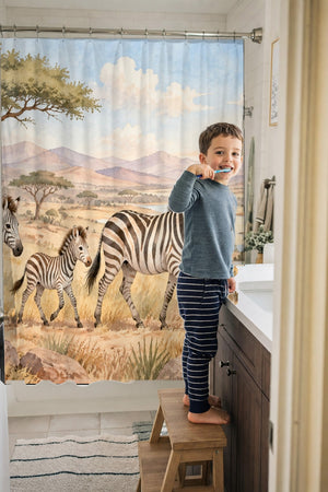 Child brushing teeth in a family bathroom with the Zebra Family Safari shower curtain