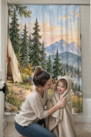 Mom drying her toddler in a hooded towel in front of the Bear Tent Sunrise Camping shower curtain