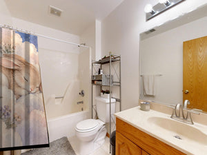 Cloud Bunny shower curtain on a tub shower combo in an American family bathroom