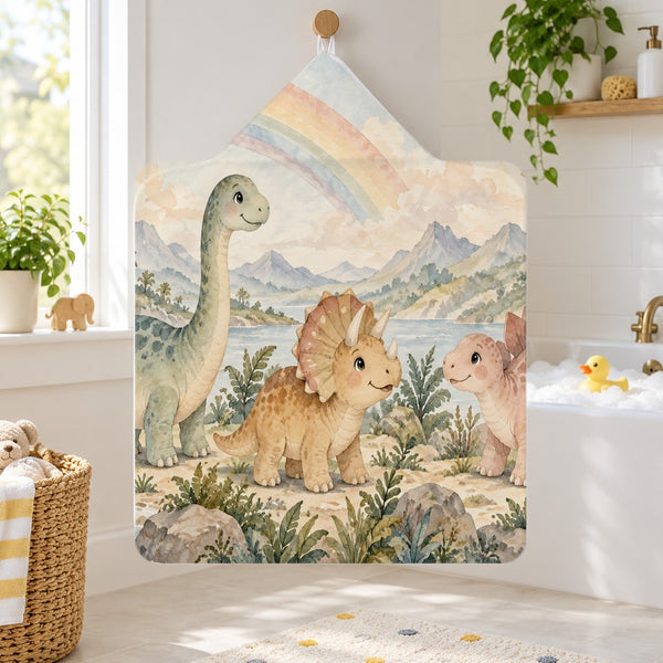 Rainbow Dinosaurs kids hooded bath towel hanging in a kids bathroom