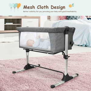 Portable baby bed side sleeper bassinet crib with carrying bag, perfect for travel and safe sleep.