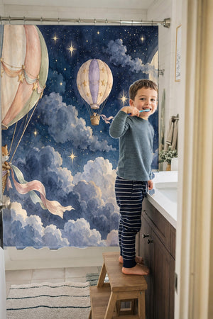 Child brushing teeth in a family bathroom with the Moonlit Flight Hot Air Balloon shower curtain