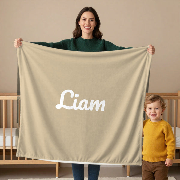 Classic Name toddler minky blanket in oatmeal, held by a mom