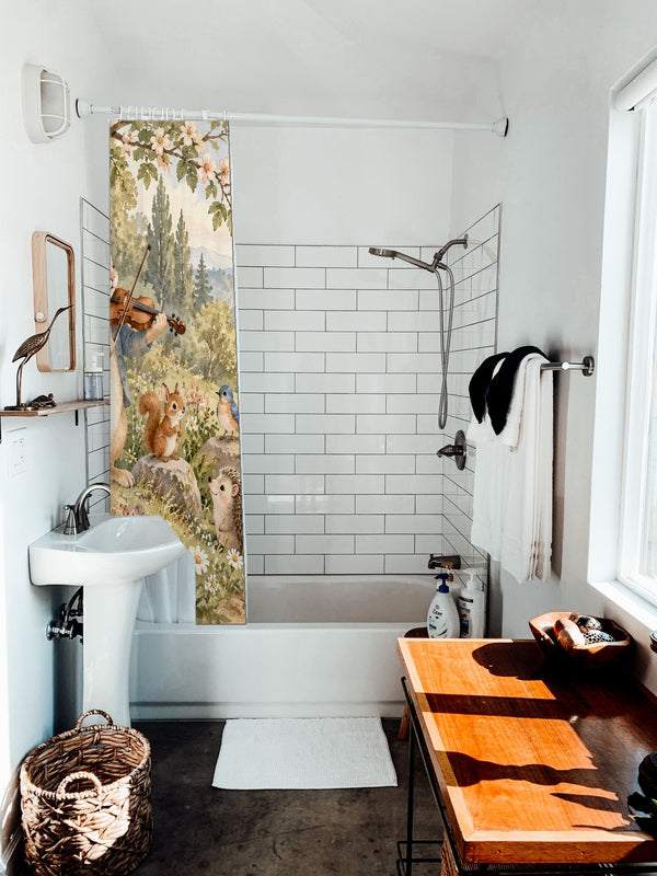 Rabbit Violin shower curtain hanging on the rod over a white bathtub