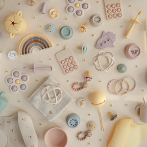 Colorful flower press toy for babies, angled view showcasing its vibrant design and engaging features.