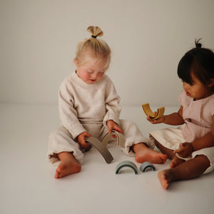 Colorful Rainbow Stacker Toy for babies, promoting sensory play and motor skills development. Angle 6 view.