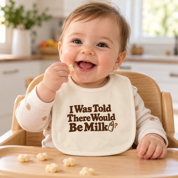 I Was Told There Would Be Milk baby bib in cream, styled photo 1