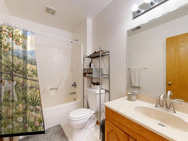 Peaceful Farm shower curtain on a tub shower combo in an American family bathroom