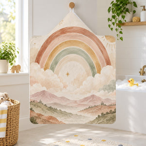 Starry Rainbow Dreamland kids hooded bath towel hanging in a kids bathroom