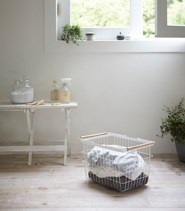 Stylish steel and wood wire laundry basket in two sizes, shown from angle 2 for versatile storage solutions.