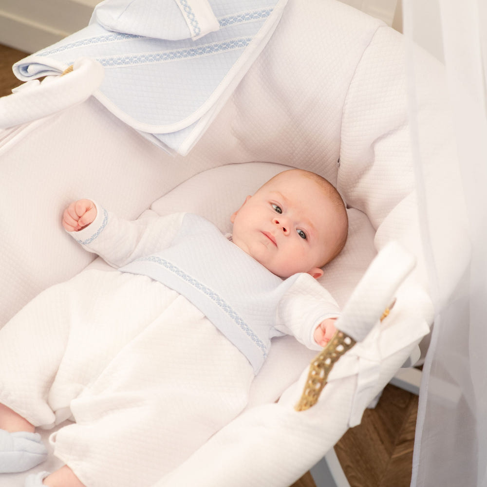 Boys white and blue quilted cotton romper for babies and toddlers, perfect for stylish comfort.