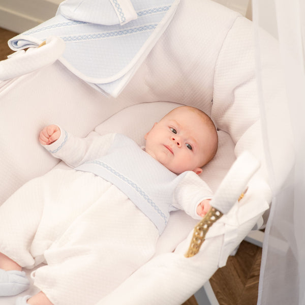 Boys white and blue quilted cotton romper for babies, stylish and comfortable ensemble, angle 2 view.