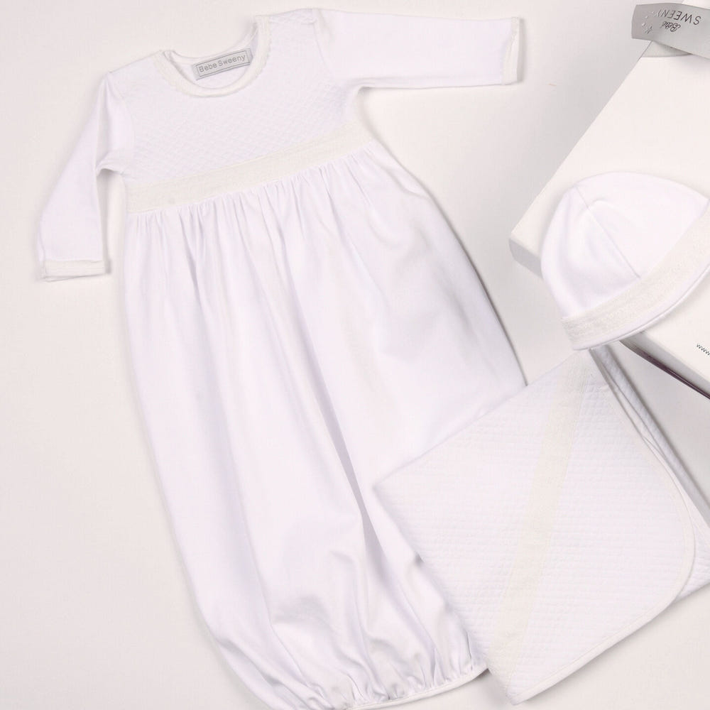 Baby white quilted cotton gown, soft and cozy ensemble for infants and toddlers. Perfect for comfort and style.